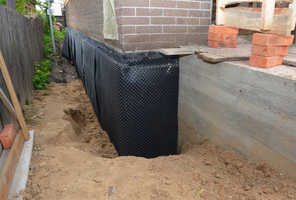 SJ Waterproofing Pros technician performing targeted Vapor Barrier Installation assessment in Embarrass, WI